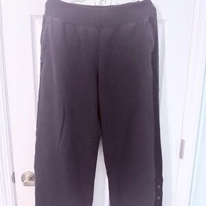 Black Athleta wide leg sweatpants with velvet trim and buttons